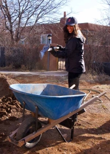 Student cleans up the grounds in a community