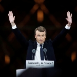 French President-elect Emmanuel Macron celebrates on the stage at his victory rally near the Louvre in Paris, France