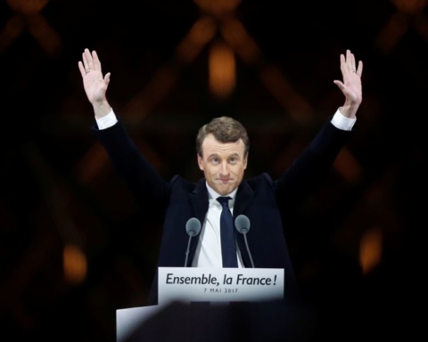 French President-elect Emmanuel Macron celebrates on the stage at his victory rally near the Louvre in Paris, France